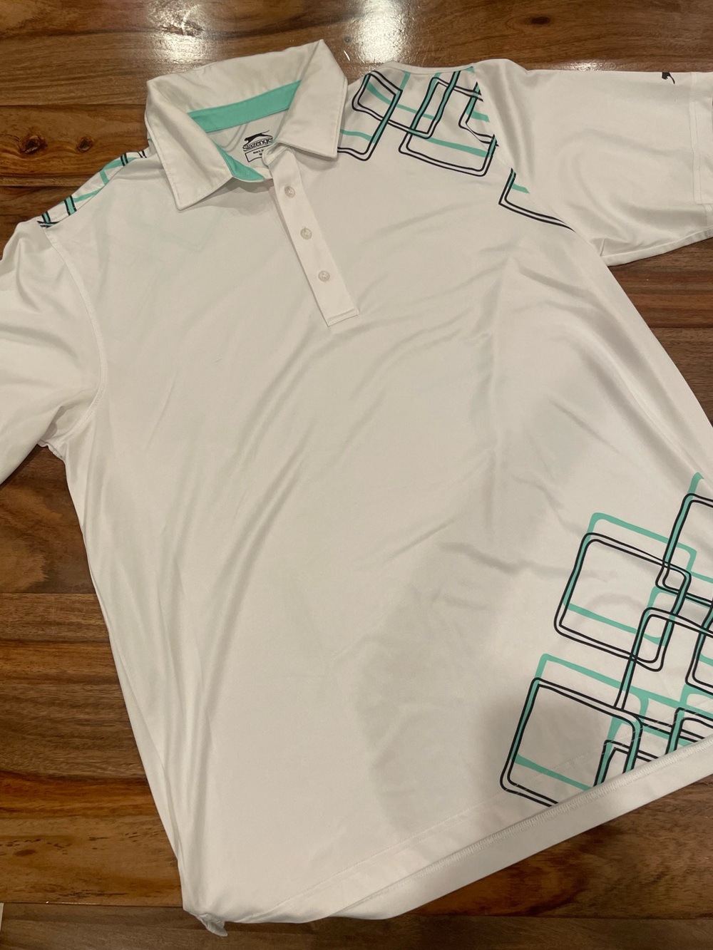 Slazenger White Polo with Teal and Black Geometric Accents